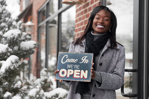 person opening storefront